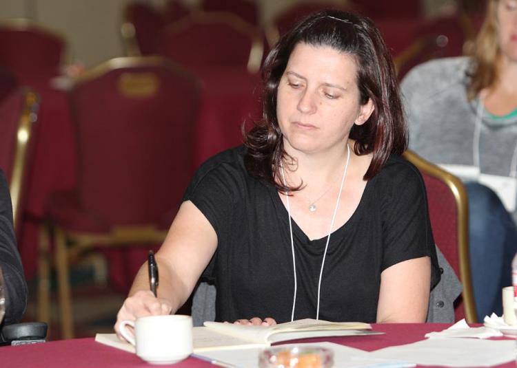 Me taking notes at the 2016 SCBWI Austin conference - Photo by Sam Bond,  sambondphotography.com 